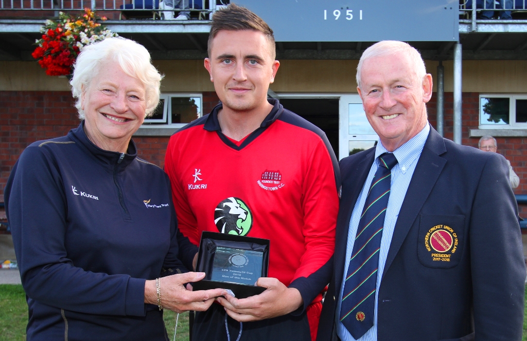 Dame Mary Peters presenting the Man of the Match award to Lee Nelson of Waringstown
